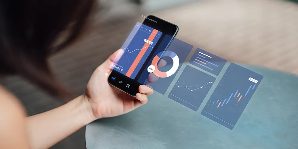 Eine Person betrachtet die Wertentwicklung ihrer Wertpapierarten auf dem Smartphone.